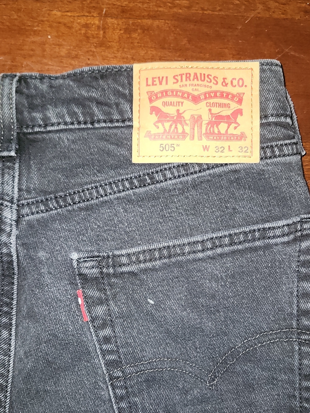Levi's Men's Straight Jeans in Washed Black with Tan Patch